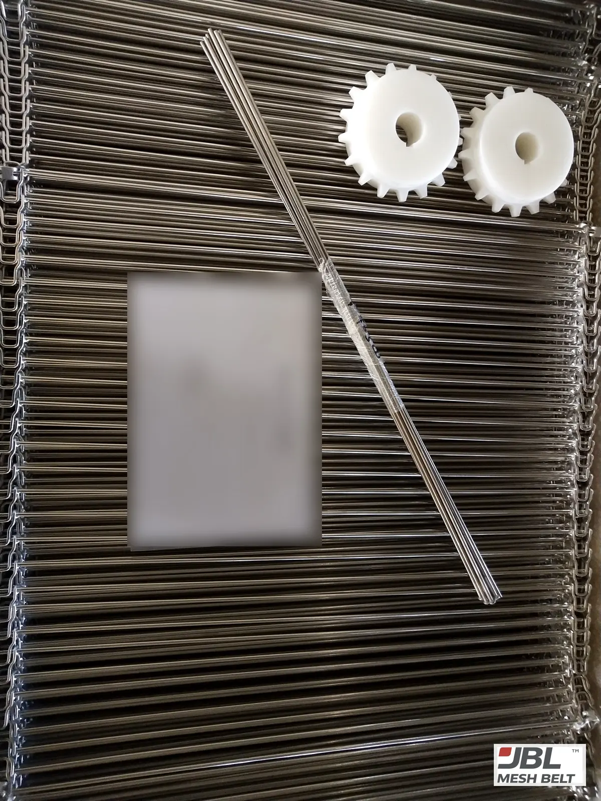 Belt with spare rods and sprockets, shipping list on top