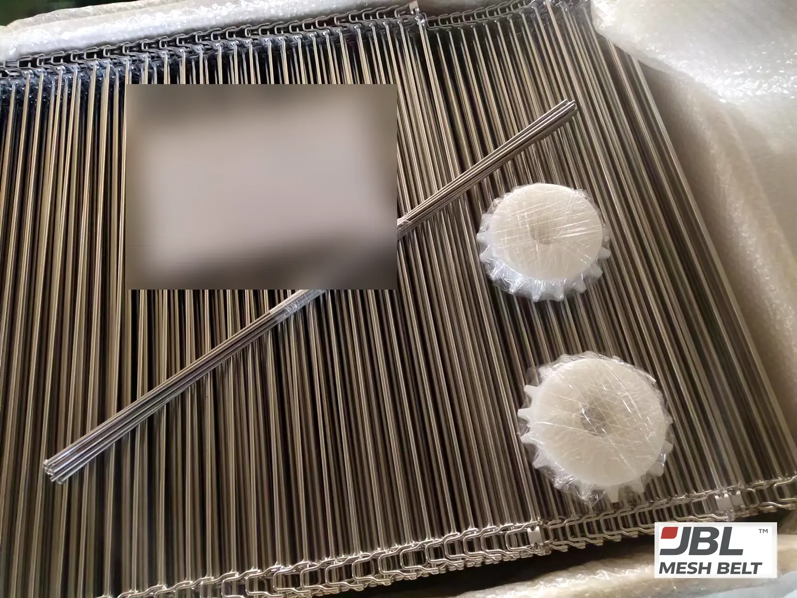 Packed in a lined crate, sprockets wrapped