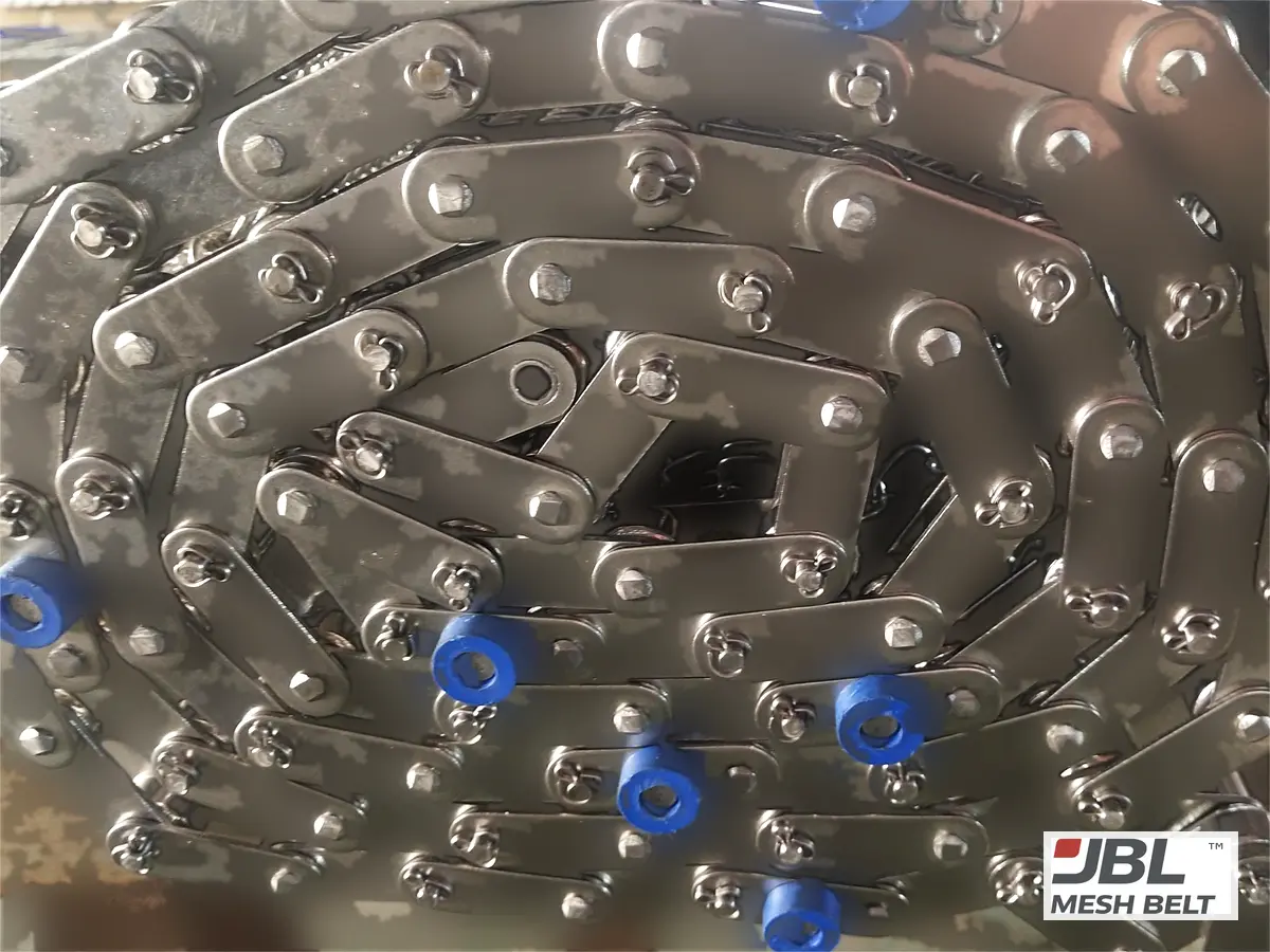 Coiled belt, chain edge and guide rollers