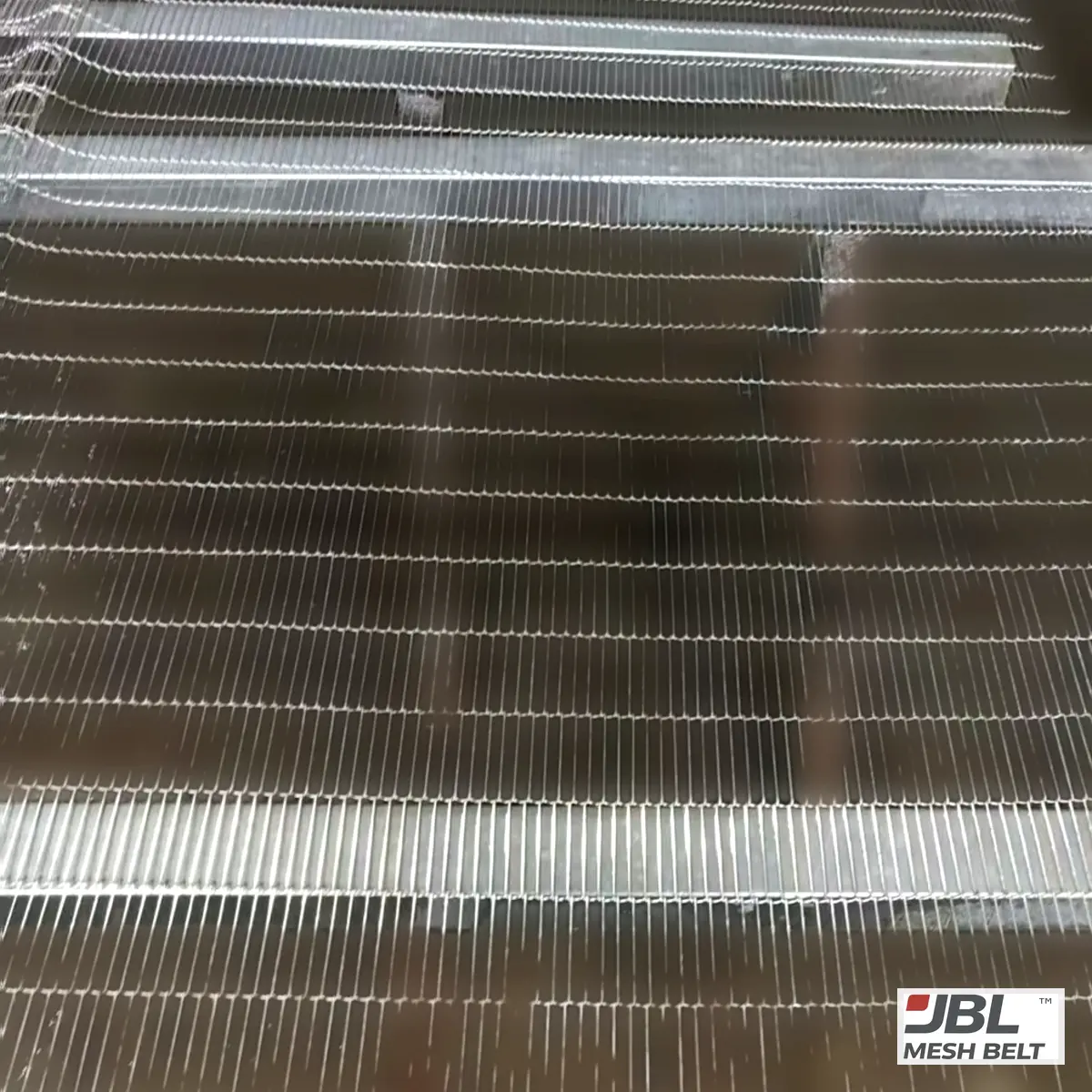 Z-type ladder belt laid on support bars for checking before packing