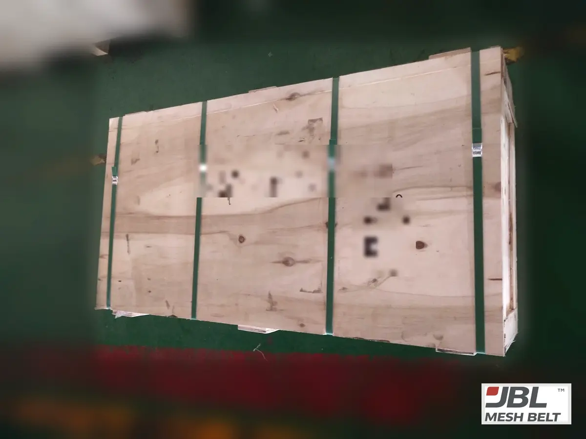 Crate strapped for export (markings blurred)