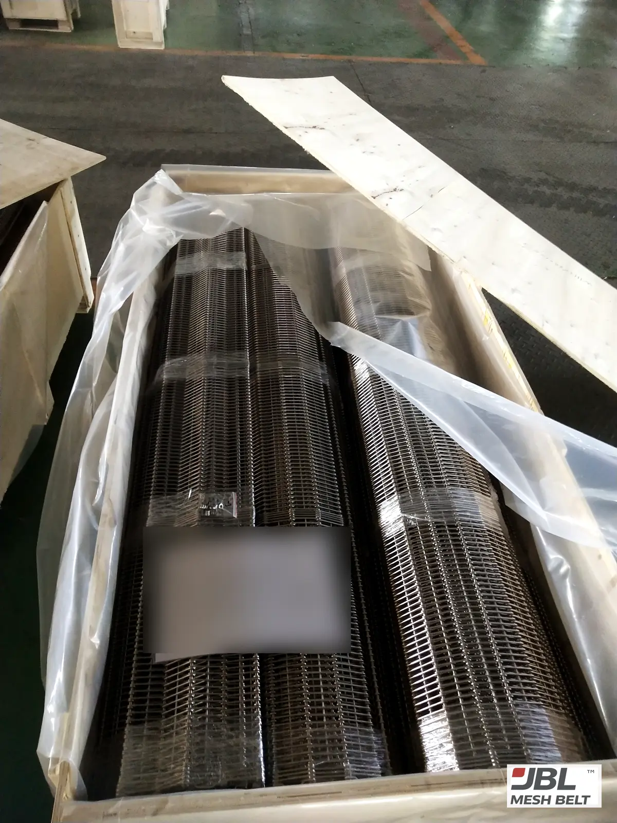 Rolled sections film-wrapped in a lined crate